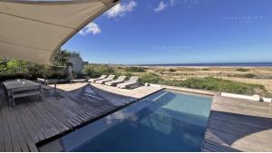 Beachfront Luxury Villa located in Manantiales, Punta del Este, Uruguay, listed by Curiocity Villas.